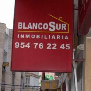 Rótulo luminoso Banderola. Blanco sur inmobiliaria Sevilla