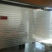 Banco Santander Granada. Trabajos para Cacelia. Rotulación de vinilos al ácido. 