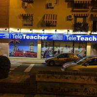Cartel rótulo frontal, rotulado con vinilos e iluminados con focos led. Tele Teacher academia Dos Hermanas Sevilla