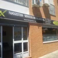 Rotulación de frente en vinilo. Famigestión, Servicios Inmobiliarios Dos Hermanas Sevilla.