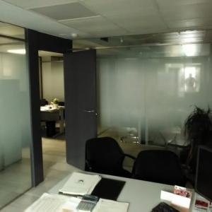 Rotulación de vinilo ácido plata para Infocón Sevilla.
