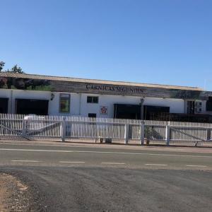 Rotulación de frente fachada en vinilos especiales al exterior. Fábrica de Segundin en Aracena Huelva