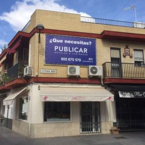 Rótulo cartel en lona enmarcada en bastidor y tensada con cuerda elástica. Dos Hermanas Sevilla.